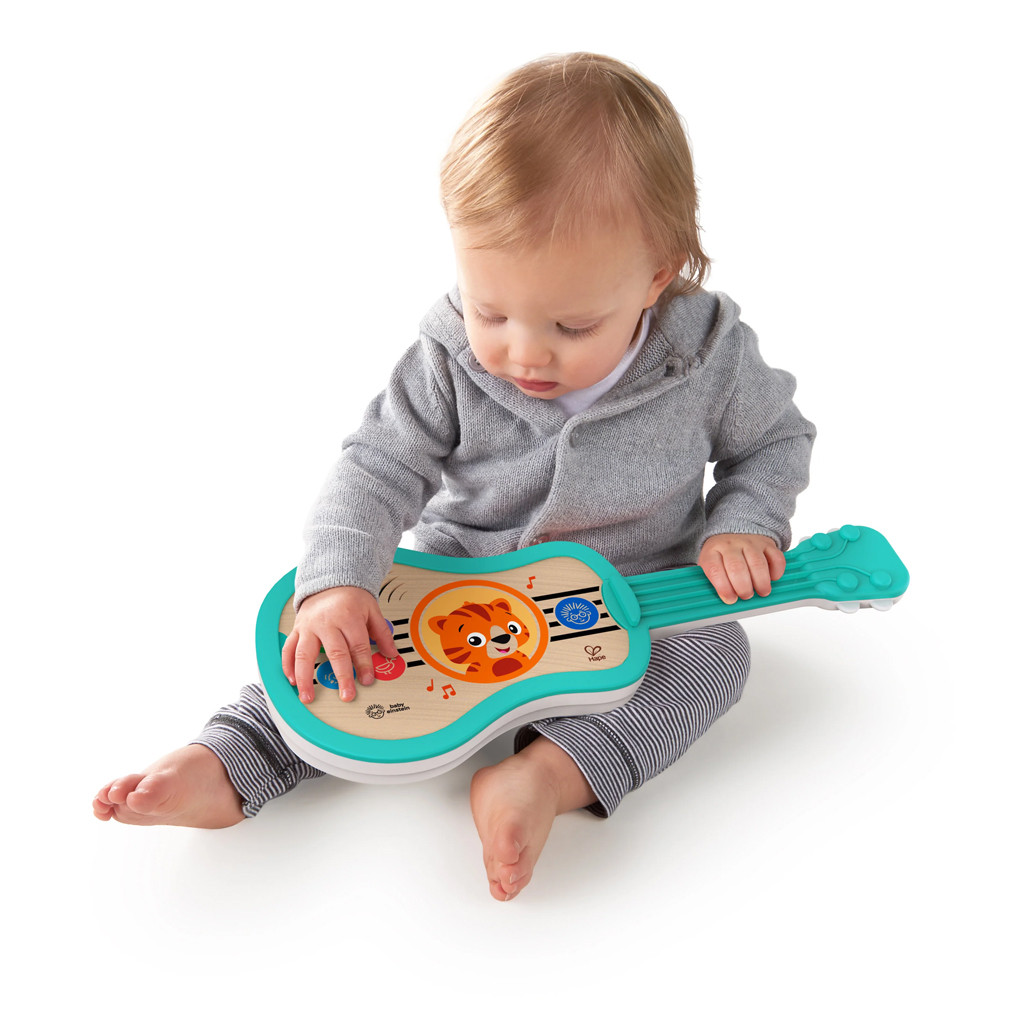 BABY EINSTEIN Zenélő fa játék ukulele Magic Touch HAPE 6hó+