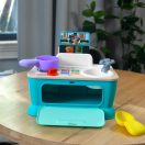 BABY EINSTEIN Zenélő játék konyha Magic Touch Kitchen™ Pretend to Cook HAPE 9hó+
