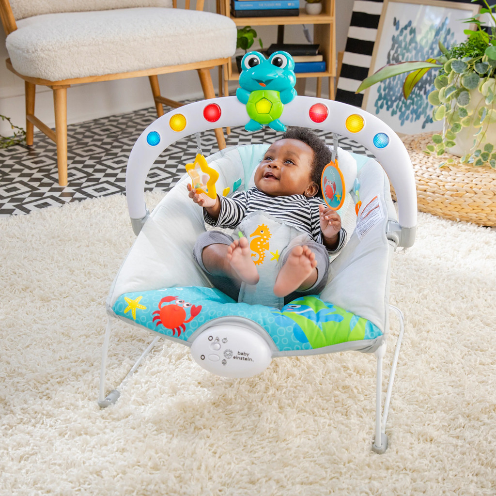 BABY EINSTEIN Zenélő rezgő pihenőszék fényekkel Kick to It Neptune 9 kg-ig