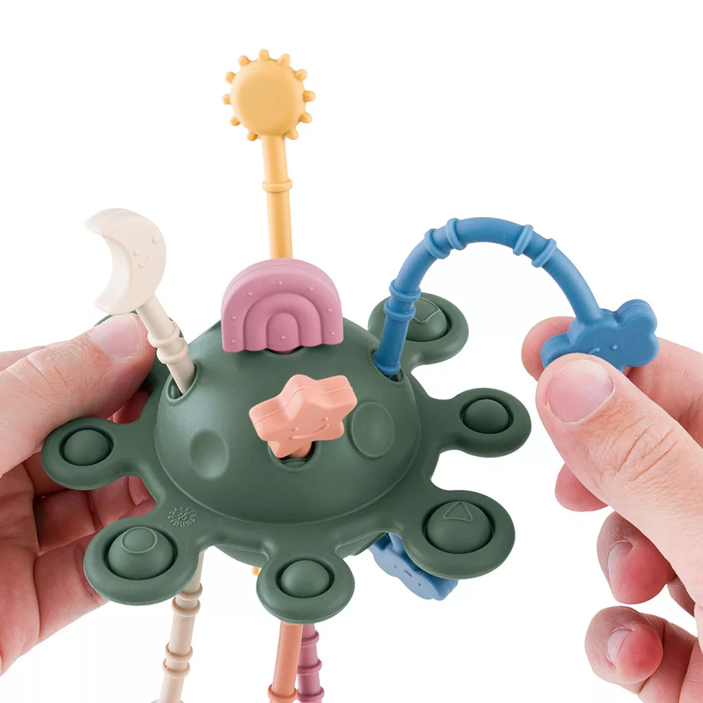 Petite&Mars Szilikon érzékszervi játék Crazy Planet Misty Green 10m+