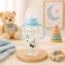 BabyBruin műanyag karcsúsított cumisüveg fogóval 240 ml (fiús)